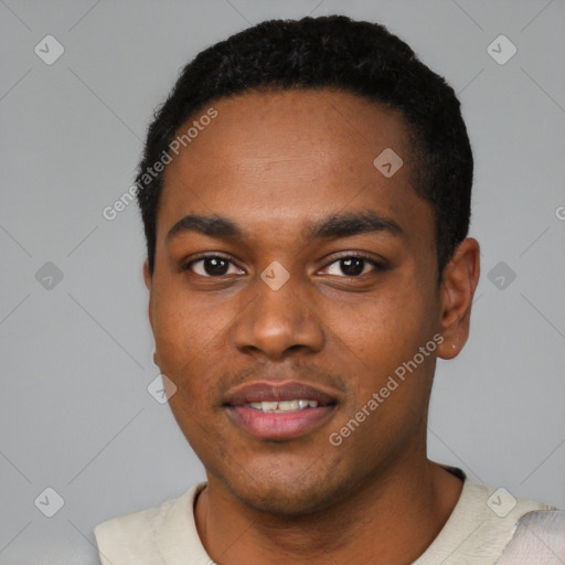 Joyful black young-adult male with short  black hair and brown eyes