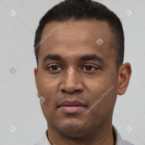Neutral latino young-adult male with short  black hair and brown eyes