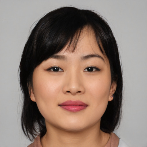 Neutral asian young-adult female with medium  black hair and brown eyes