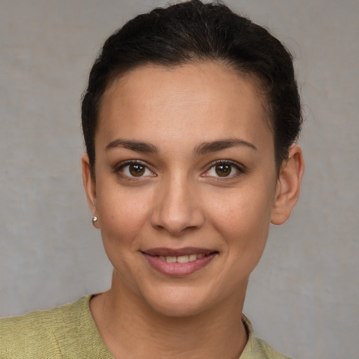 Joyful white young-adult female with short  brown hair and brown eyes