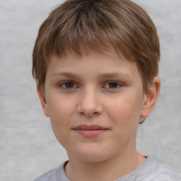 Joyful white child male with short  brown hair and brown eyes