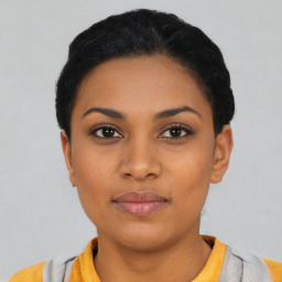 Neutral latino young-adult female with short  black hair and brown eyes