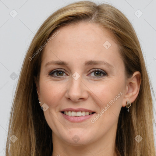 Joyful white adult female with long  brown hair and grey eyes