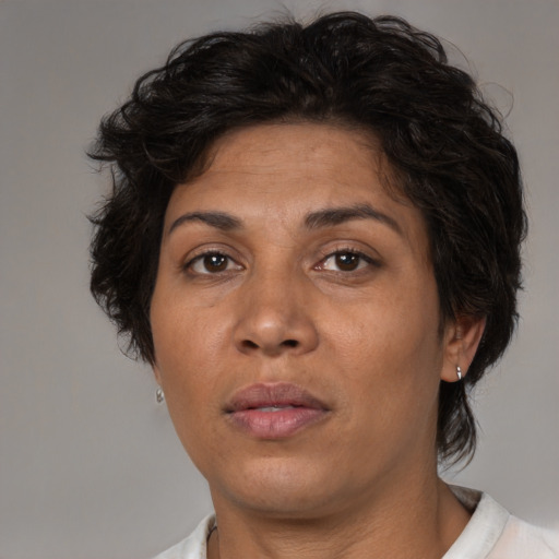 Joyful asian adult female with medium  brown hair and brown eyes