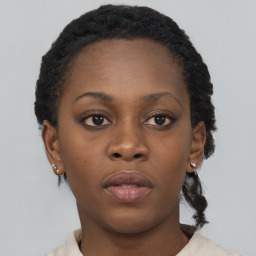 Neutral black young-adult female with short  brown hair and brown eyes