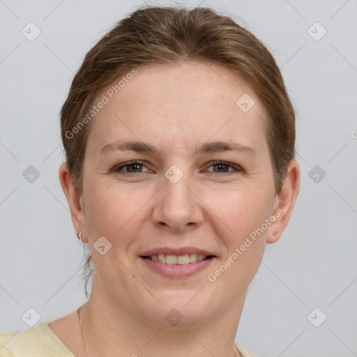 Joyful white young-adult female with short  brown hair and grey eyes