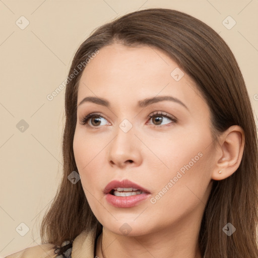 Neutral white young-adult female with long  brown hair and brown eyes