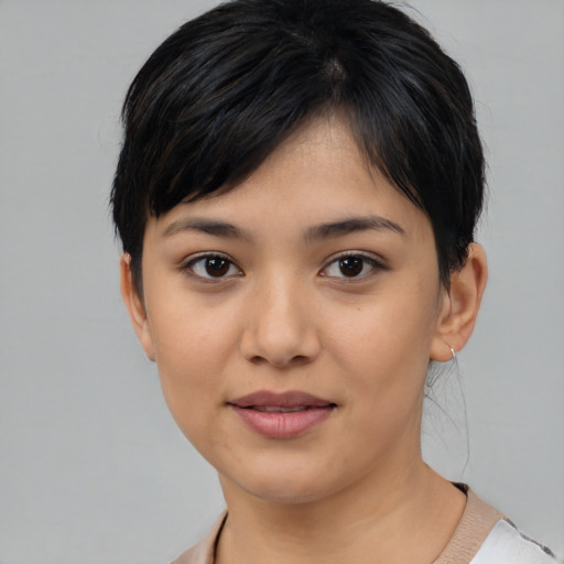 Joyful asian young-adult female with medium  black hair and brown eyes