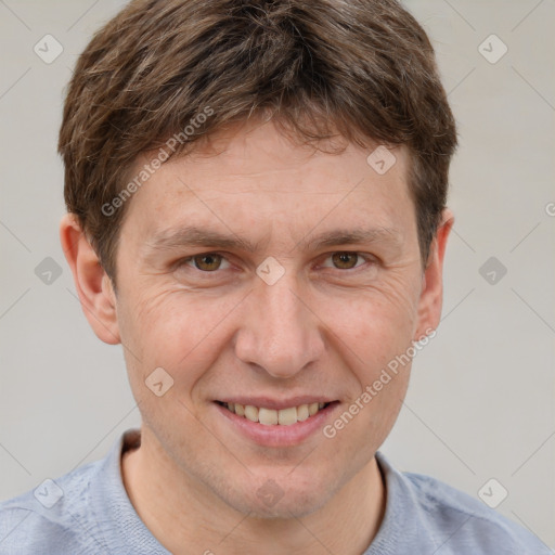 Joyful white adult male with short  brown hair and grey eyes