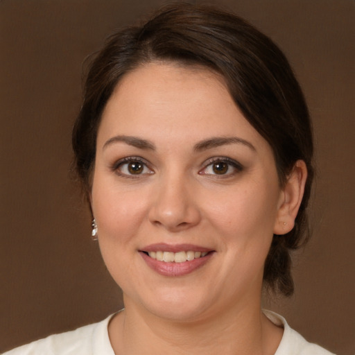 Joyful white young-adult female with medium  brown hair and brown eyes