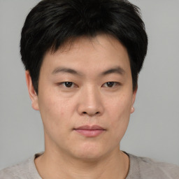 Neutral asian young-adult male with short  brown hair and brown eyes