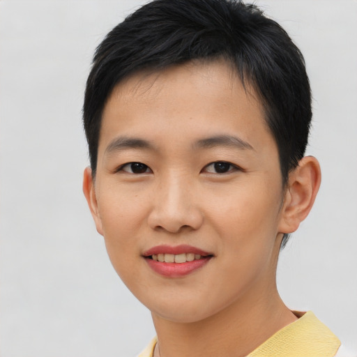 Joyful asian young-adult female with short  black hair and brown eyes