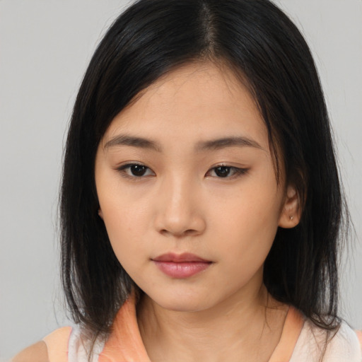 Neutral asian young-adult female with medium  brown hair and brown eyes