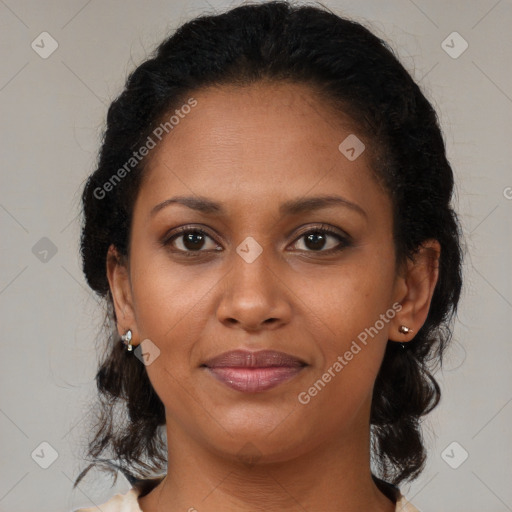 Joyful black adult female with medium  brown hair and brown eyes