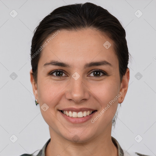 Joyful white young-adult female with medium  brown hair and brown eyes