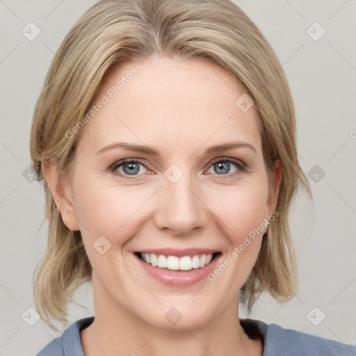 Joyful white young-adult female with medium  brown hair and blue eyes