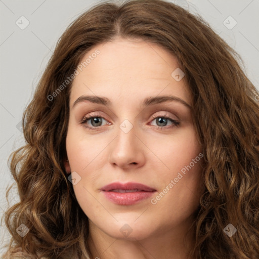 Joyful white young-adult female with long  brown hair and green eyes