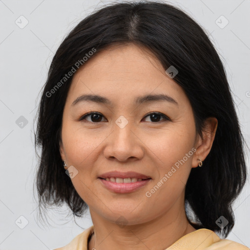 Joyful asian young-adult female with medium  brown hair and brown eyes