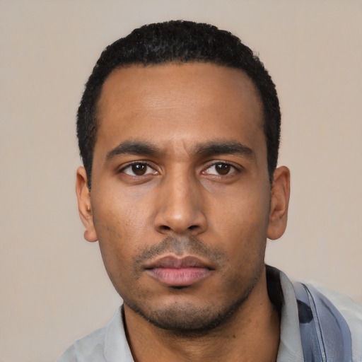 Neutral latino young-adult male with short  black hair and brown eyes