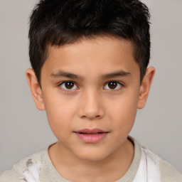 Joyful white child male with short  brown hair and brown eyes