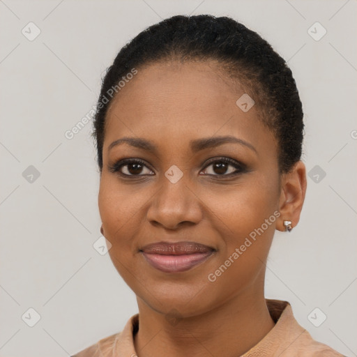 Joyful black young-adult female with short  black hair and brown eyes