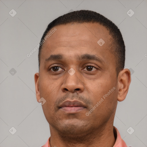 Neutral black adult male with short  black hair and brown eyes
