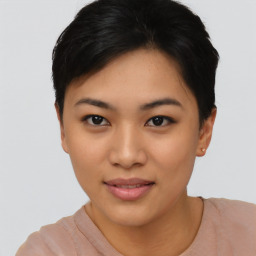 Joyful asian young-adult female with short  black hair and brown eyes