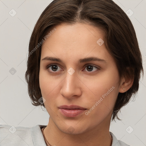 Neutral white young-adult female with short  brown hair and brown eyes