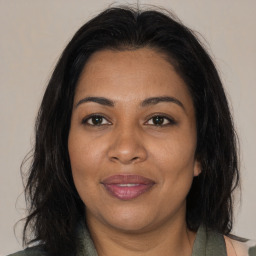 Joyful black adult female with medium  brown hair and brown eyes