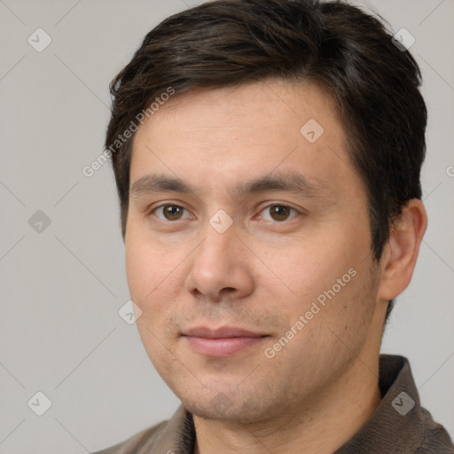 Joyful white adult male with short  brown hair and brown eyes