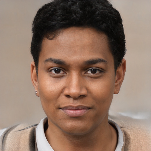 Joyful black young-adult male with short  black hair and brown eyes