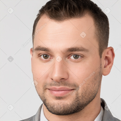 Joyful white young-adult male with short  brown hair and brown eyes