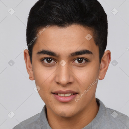 Joyful latino young-adult male with short  brown hair and brown eyes