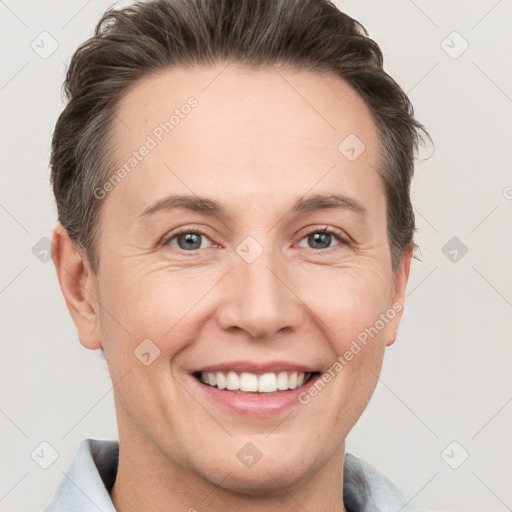 Joyful white adult female with short  brown hair and grey eyes