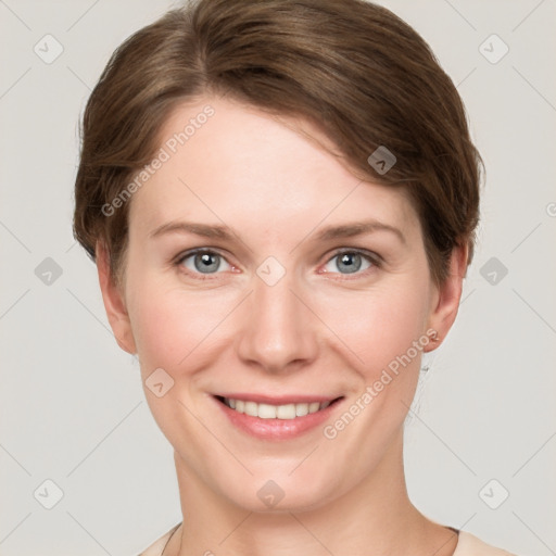 Joyful white young-adult female with short  brown hair and grey eyes