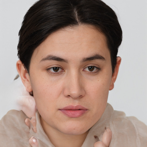 Joyful white young-adult female with short  brown hair and brown eyes