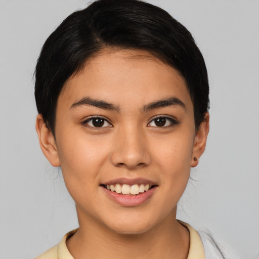 Joyful latino young-adult female with short  brown hair and brown eyes