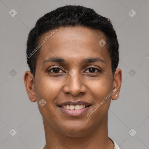 Joyful black young-adult male with short  brown hair and brown eyes