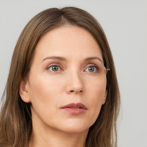 Neutral white young-adult female with long  brown hair and grey eyes