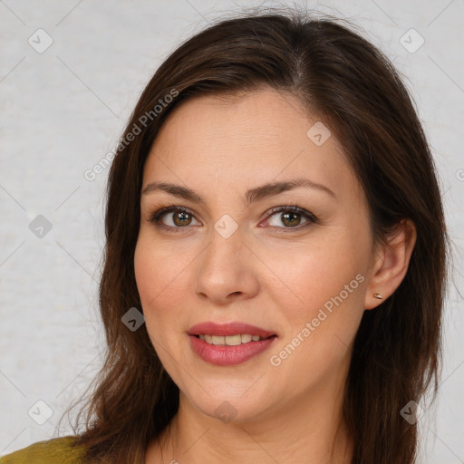 Joyful white young-adult female with long  brown hair and brown eyes