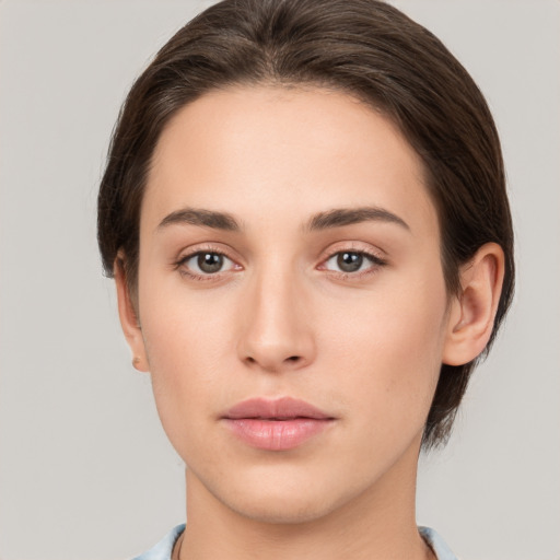 Neutral white young-adult female with short  brown hair and brown eyes