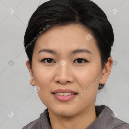 Joyful asian young-adult female with medium  black hair and brown eyes