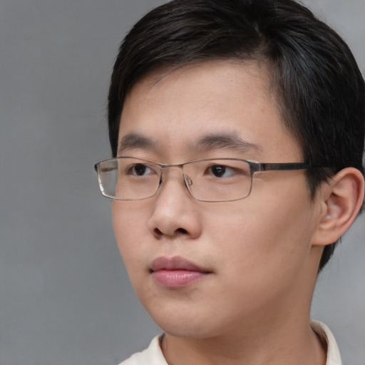 Neutral asian young-adult male with short  brown hair and brown eyes