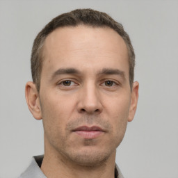 Neutral white young-adult male with short  brown hair and brown eyes