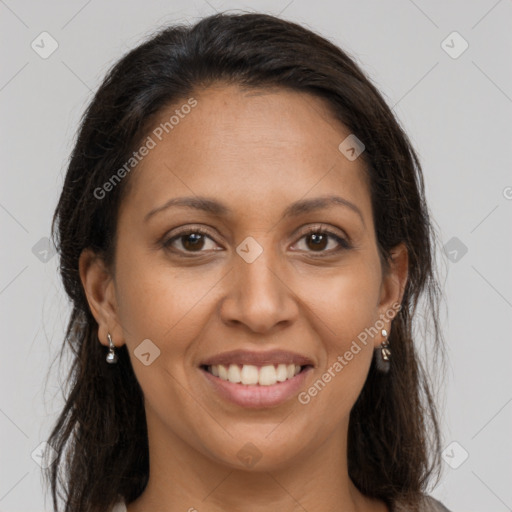 Joyful latino young-adult female with long  brown hair and brown eyes