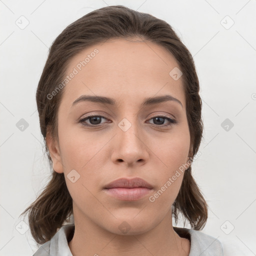 Neutral white young-adult female with medium  brown hair and brown eyes