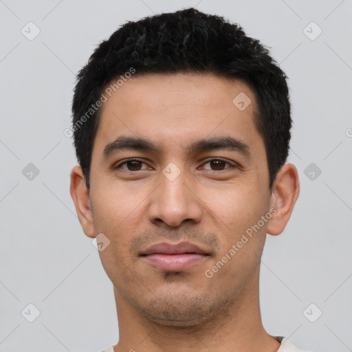 Neutral latino young-adult male with short  black hair and brown eyes