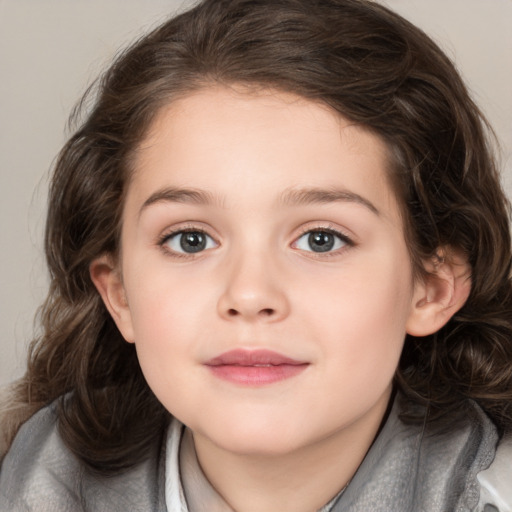 Joyful white child female with medium  brown hair and brown eyes