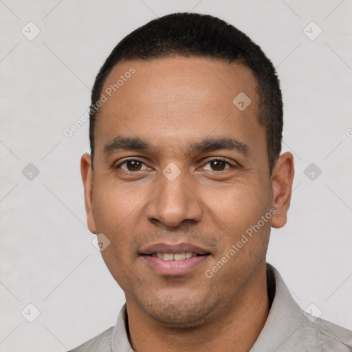 Joyful white young-adult male with short  black hair and brown eyes