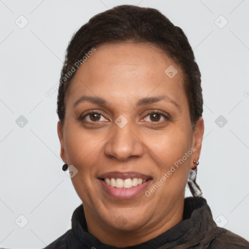 Joyful latino adult female with short  brown hair and brown eyes